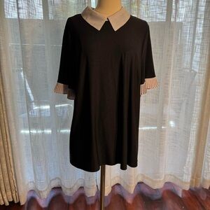 Black short sleeve button-up top with white collar and cuffs